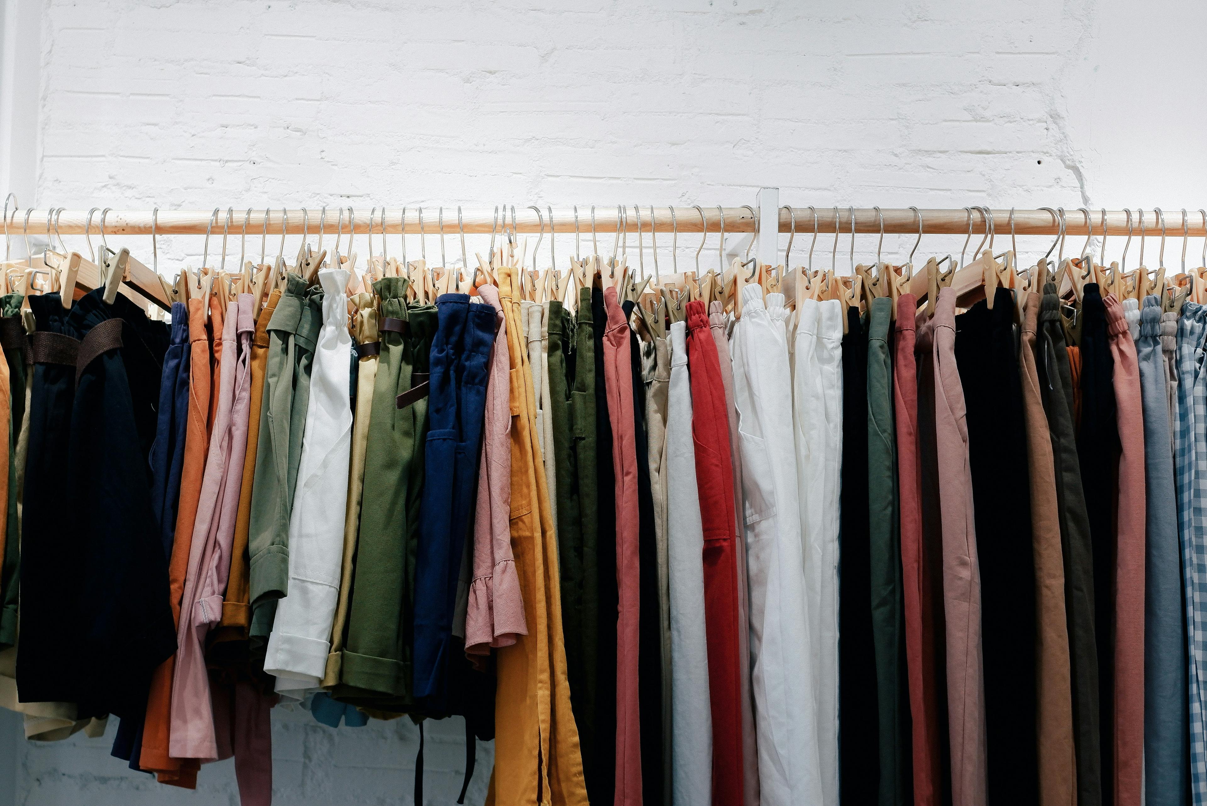 A large number of clothes hanging - background banner